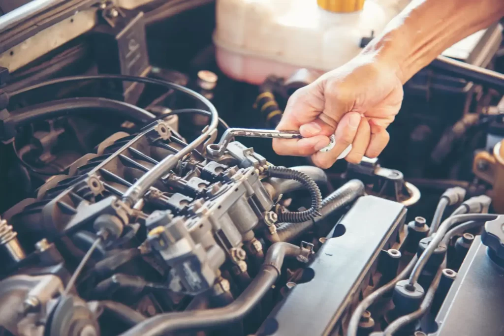 An Automotive engine repairing with wrench, Auto repair services